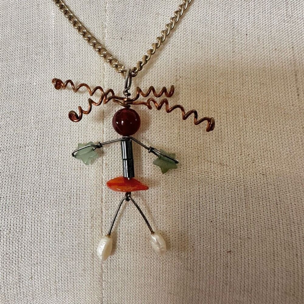 Gold/copper tone natural stones person pendant necklace